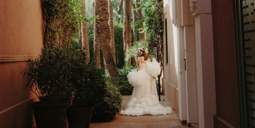 Bride walking through Royal Mansour garden path in Marrakech